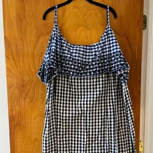 Cute summer dress, gingham pattern with floral embroidery on top.